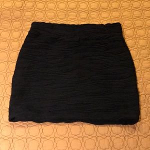 Short black textured mini skirt